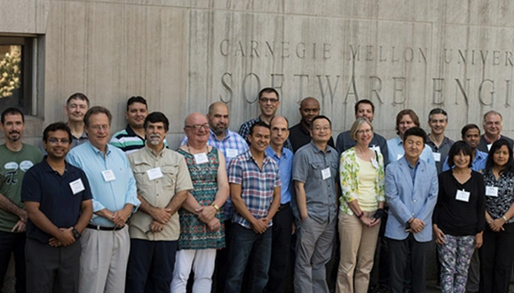 Attendees of the 14th annual Workshop for Educators stand outside of the Software Engineering Institute in Pittsburgh, PA.