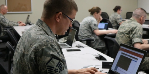 US Army personnel engaged in cyber workforce training.