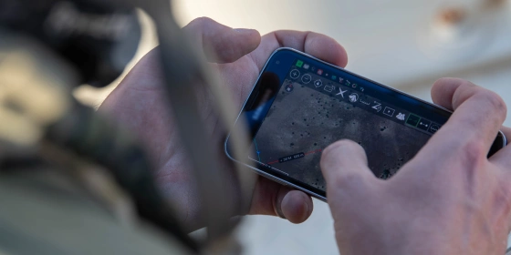 Close-up of an IoT device in use during a US Air Force training scenario.