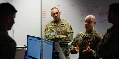Four uniformed US Air Force personnel discuss an insider threat.