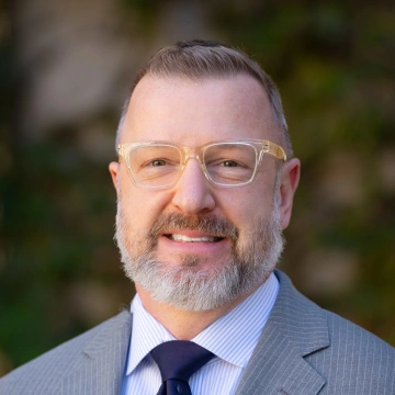 Headshot of Jason Fricke.