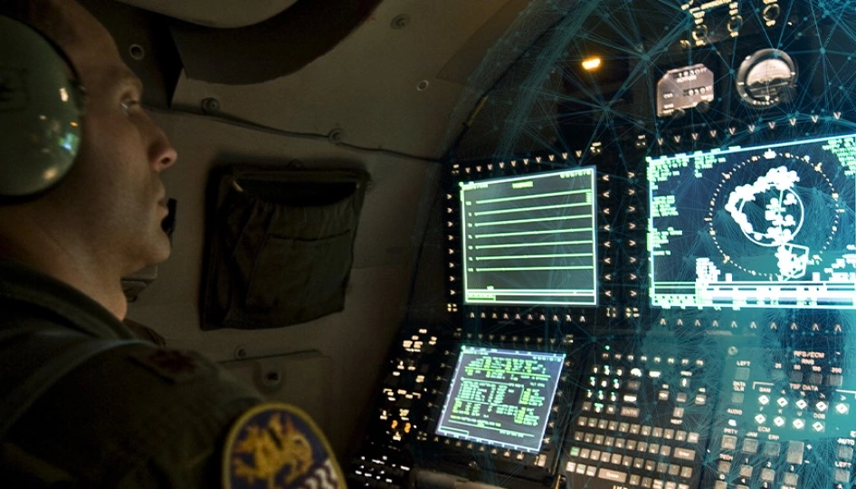 Uniformed operator looks at control monitors