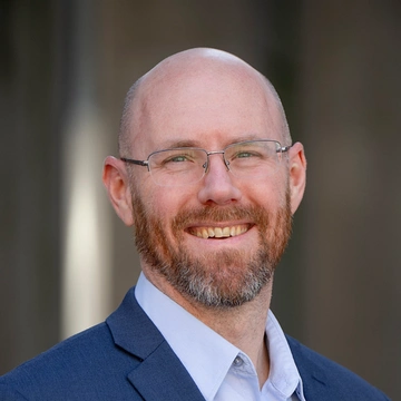 Headshot of David Schulker.