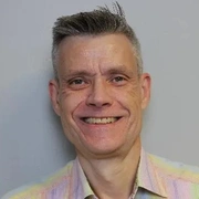 Headshot of Mark Thomas.