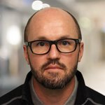 Headshot of Dustin Updyke.