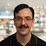 Headshot of William Reed.