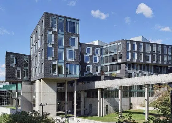 The exterior of an office building on a sunny day.