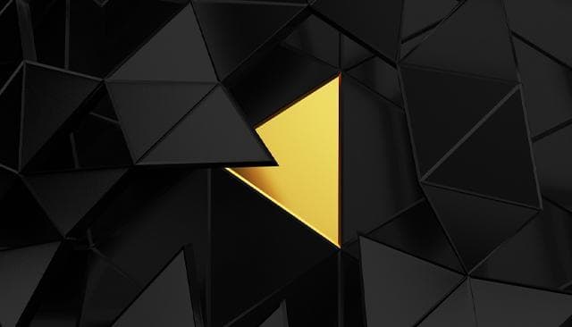 Illustration of black intersecting triangles with one golden triangle.